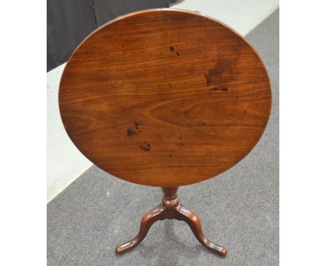 A 19th Century mahogany circular snap-top supper or occasional table, raised to a turned gun barrel style support with tripod