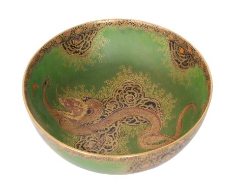 A 1930s Art Deco Carlton Ware footed bowl decorated in the Dragon and Cloud pattern with gilt decoration over a green ground,