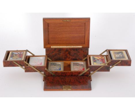 A 1930s burr thuya wood playing card case with internal concertina action, width 21cm