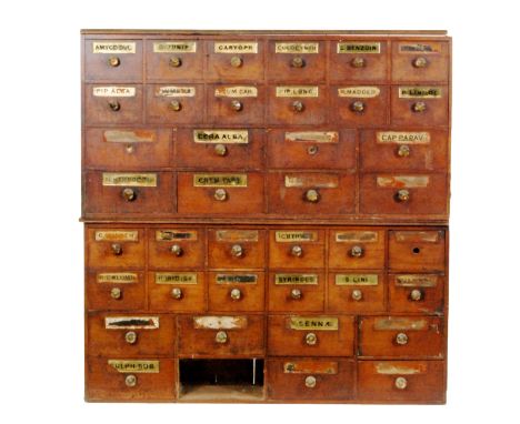 A late 19th to early 20th Century mahogany and pine lined bank of thirty nine apothecary drawers, configured in an arrangemen