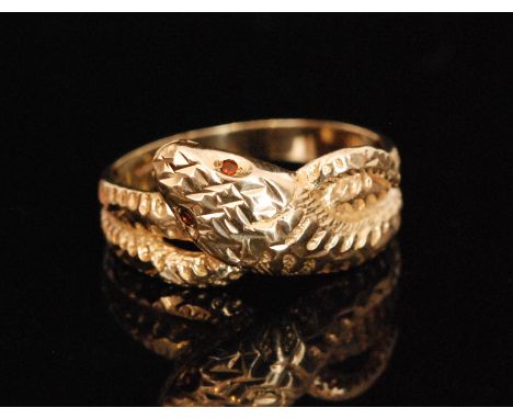 A modern 9ct hallmarked double snake ring, textured body and ruby set eyes, ring size W. 