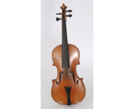 A late 19th Century twin piece violin bears label Joseph Guarnerius fecit 1742 to interior, length 36cm, together with an ass