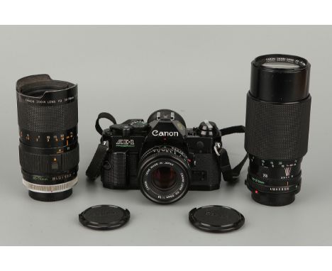 A Canon AE-1 Program SLR Camera, with FD f/1.8 50mm lens, together with FD S.S.C. f/2.8-3.5 35-70mm and FD f/4 70-210mm lense