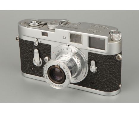 A Leica M2 Rangefinder Camera, chrome, serial no. 1086443, with Leitz Elmar f/3.5 50mm lens, chrome, serial no. 772496, shutt