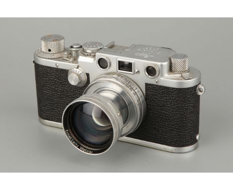 A Leica IIIf Rangefinder Camera, chrome, serial no. 603073, with Leitz Summitar f/2 50mm lens, chrome, serial no. 911459