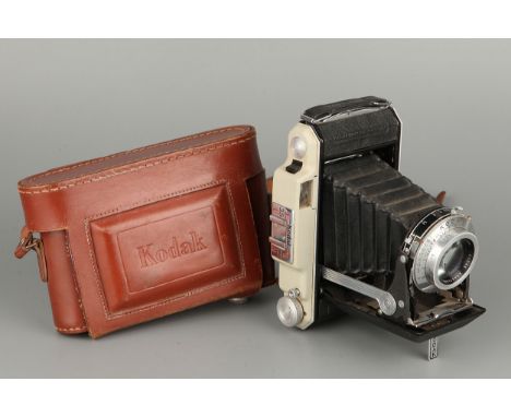 A Kodak 620 Folding Camera, with Angenieux f/3.5 100mm lens, in maker's case