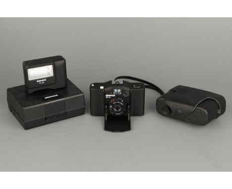 A Minox 35AL Compact Camera, together with FA35 flash unit, in maker's case and box