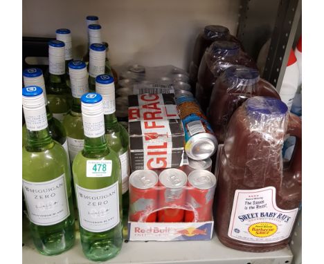 Ten bottles of alcohol free wine: together with cans of Red Bull and catering size BBQ sauce bottles. 