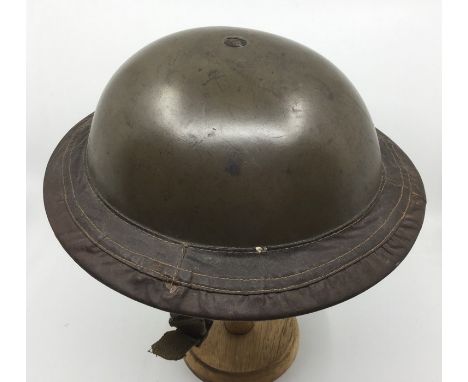 WW2 British MKII Steel helmet with smooth green paint finish. Size 7 liner by Vero dated 1938. Complete with chinstrap which 