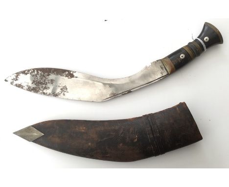 Kukri knife with 30cm blade. Overall length 41cm. Complete with scabbard. White metal chape. Both small knives missing.