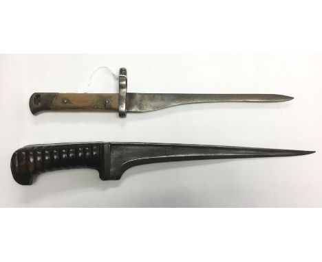 One dagger with a single edged 29cm long blade. Overall length 40cm. No scabbard. Together with a bayonet with a ground down 