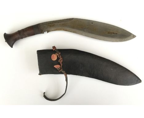 Kukri Knife 32cm long blade. No makers mark. Wooden grip with carved decoration. Overall length 44cm. Complete with scabbard.