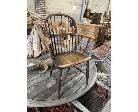 A 19th century Windsor elm and beech comb back elbow chair, width 57cm, depth 36cm, height 90cm