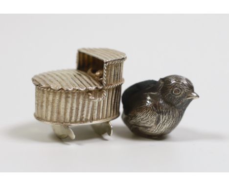 A George V silver mounted chick pin cushion, Birmingham, 1922, 39mm and a late 19th century Dutch? white metal miniature mode