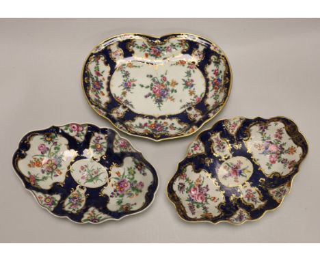 A pair of Worcester oval lobed dishes painted with flowers on a blue scale ground and a matching heart shaped dish-28cm wide 