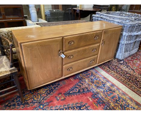 An Ercol light elm sideboard, length 155cm, depth 43cm, height 68cm