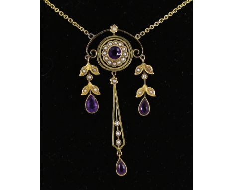 An early 20th century 9ct, amethyst and seed pearl set triple drop pendant necklace, overall 48cm, gross weight 5.5 grams.