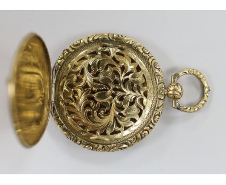 An engine turned yellow metal circular vinaigrette with pierced foliate grille, diameter 35mm.