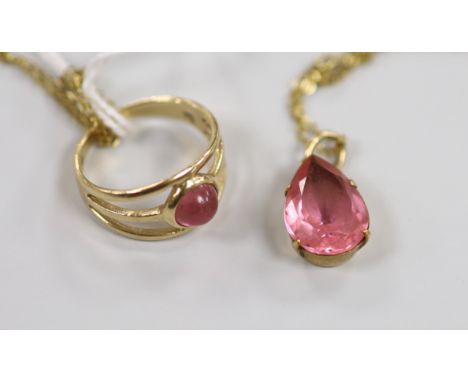 A modern 9ct gold and pink cabochon set ring, size K, together with a yellow metal and pear shaped pink stone set pendant nec