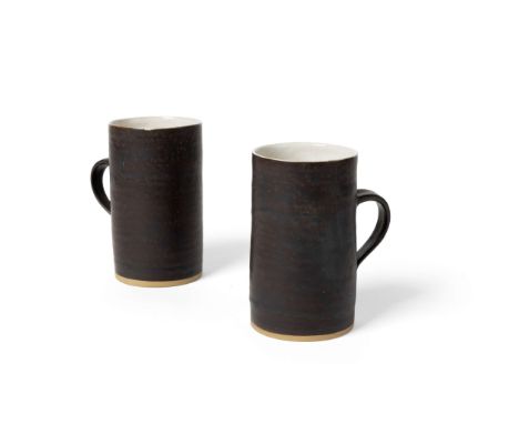  DAME LUCIE RIE D.B.E. (AUSTRIAN/BRITISH 1902-1995) PAIR OF COFFEE MUGS, c. 1960 impressed maker's mark, stone, manganese gla