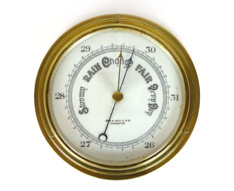 A brass aneroid barometer by John Barker of Kensington, 23 cm diameter