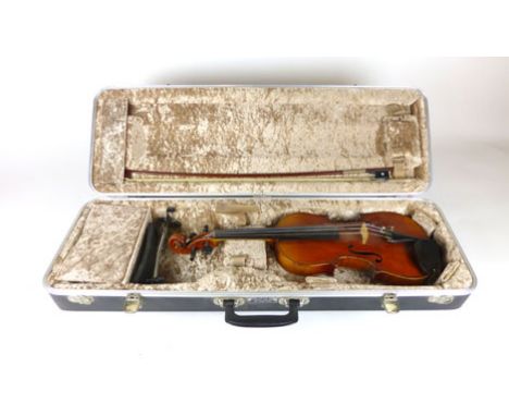 A near full size violin, two piece back, applied paper label stamped Straduarius, length of back 35 cm, cased with bow and Wi