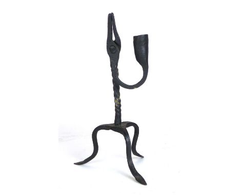 A wrought iron rush light, probably 18th century on a tripod base. h. 23 cm CONDITION REPORT: Good for age