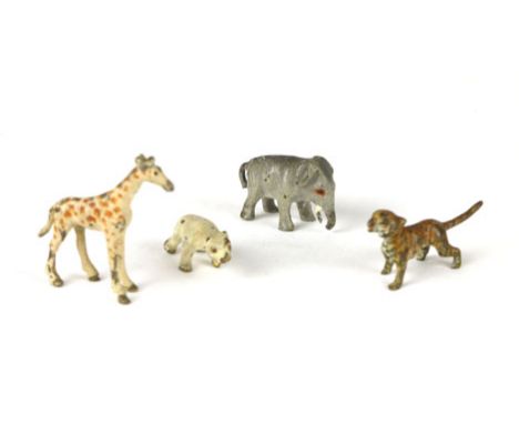 Four miniature cold painted bronze exotic animals to include an elephant, giraffe, tiger and a polar bear, giraffe h. 2 cm (4