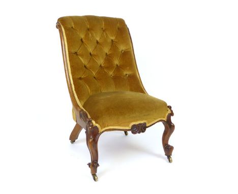 A Victorian walnut framed nursing chair, button back, serpentine seat, cabriole front legs CONDITION REPORT: Some joints loos
