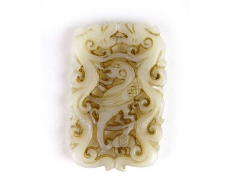 A white jade type carved panel of two dragons either side of an exotic bird. l. 7 cm  CONDITION REPORT: Good
