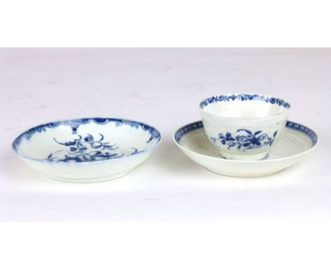 A Worcester tea bowl painted with floral sprays over a moulded ground, together with a florally painted saucer and another sa