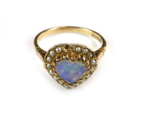 A 9ct gold, opal and split pearl mounted heart shaped ring, hallmarked CONDITION REPORT: Ring size- M. 
Opal- 6mm x 6mm.
One 