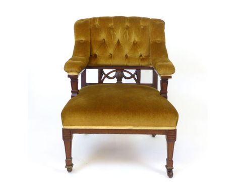 A Victorian mahogany framed easy chair, button back and stuffed over seat CONDITION REPORT: Joints reglued, some slight losse