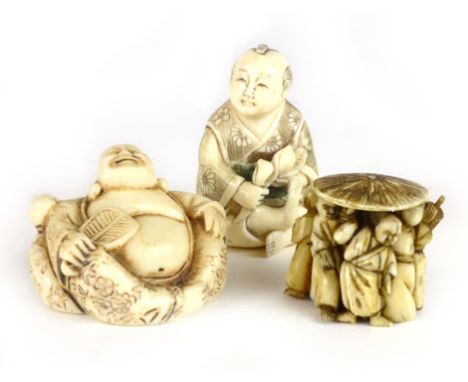 A Japanese ivory netsuke or okimono, carved as a boy seated cross legged, together with two other similar items (3) CONDITION