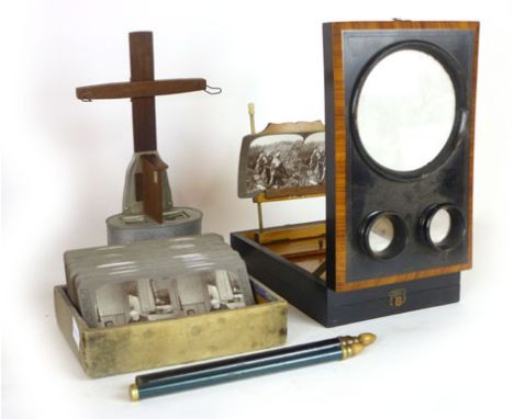 A rosewood and ebonised stereoscope viewer together with a collection of stereoscope cards of First World war scenes, includi