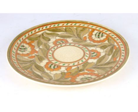 Charlotte Rhead for Crown Ducal, a pottery charger decorated with orange and brown floral bands within a cream ground, d. 32 