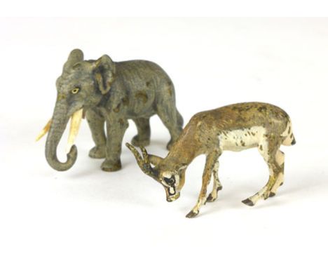 A cold painted miniature bronze of an elephant, together with another of an antelope, h. 3.5 cm and smaller (2)  CONDITION RE