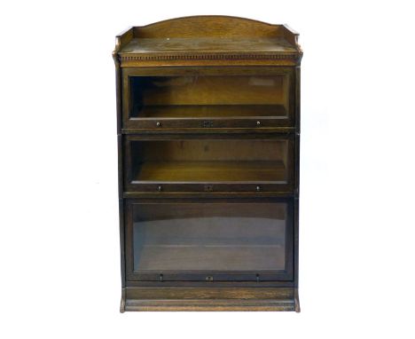 The Lebus oak globe wernicke style three section bookcase. h. 123 cm CONDITION REPORT: Some splits to the wood, some surface 