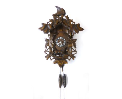 A Swiss Black Forest Cuckoo Clock, two train with pine cone weights, carved with a bird and a fox, height 62cm CONDITION REPO