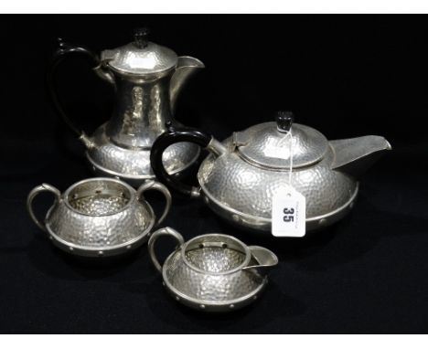 A Craftsman Of Sheffield Beaten Pewter Four Piece Tea Service