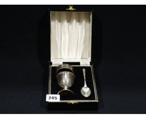 A Cased Silver Egg Cup And Serviette Ring With Non Matching Spoon