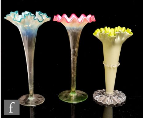 A late 19th Century Stourbridge glass posy vase of wrythen fluted trumpet for with a sunrise opal rim falling to a pale green