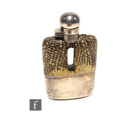 A hallmarked silver and snaked mounted glass hip flask with silver bayonet cap and sleeve, height 10cm, Sheffield 1930, James