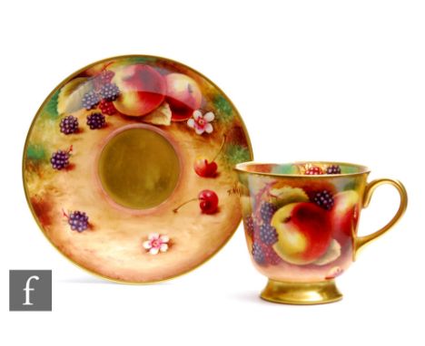 A later 20th Century cabinet cup and saucer decorated by former Royal Worcester artist Terence Nutt with hand painted apples 