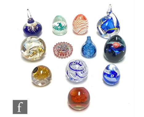 A collection of paperweights to include Caithness, Selkirk and Langham with internal air bubble swirl and cane work decoratio