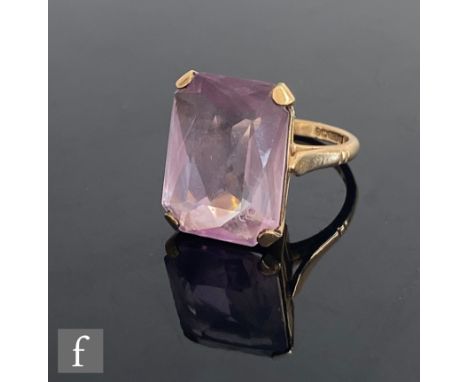 A 9ct hallmarked single stone amethyst ring, emerald cut claw set stone to plain shoulders, weight 5g, ring size L. 