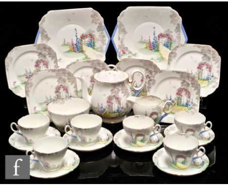 A Shelley Cambridge shape teaset decorated in the Archway of Roses pattern comprising a teapot, six cups, six saucers, six si