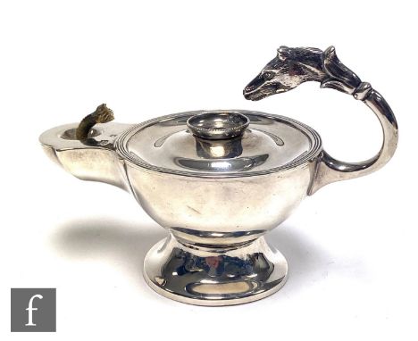 A hallmarked silver table lamp modelled as a Roman oil lamp with flying scroll handle terminating in a horse's head, weight 5