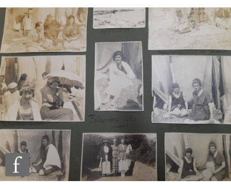 A collection of late 19th to early 20th Century portrait photographs, postcards and scrap books, mostly contained within albu