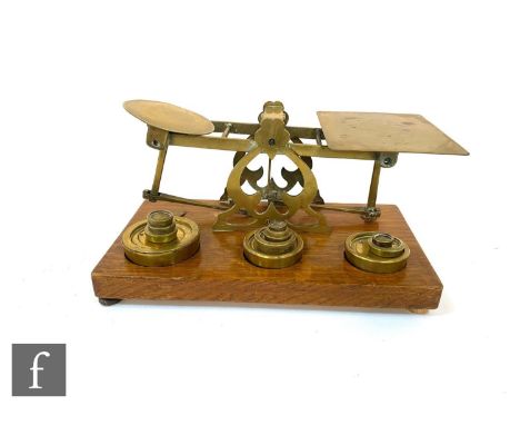 A set of late 19th to early 20th Century S. Mordan &amp; Co brass postage scales with twelve brass weights, stamped to the pl